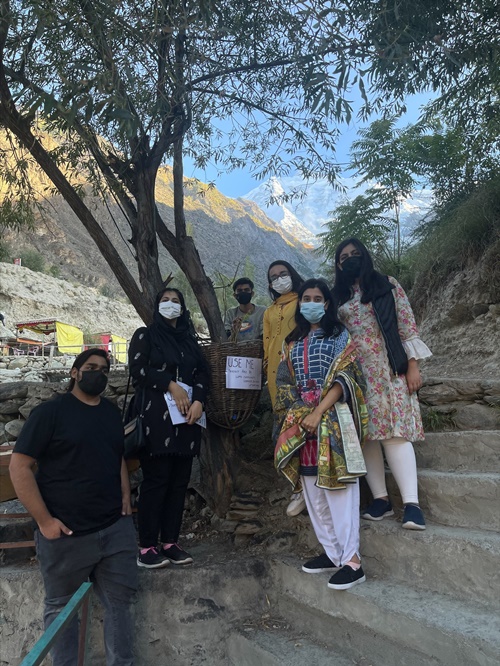 The team members who made the visit standing near one of their installed dustbin