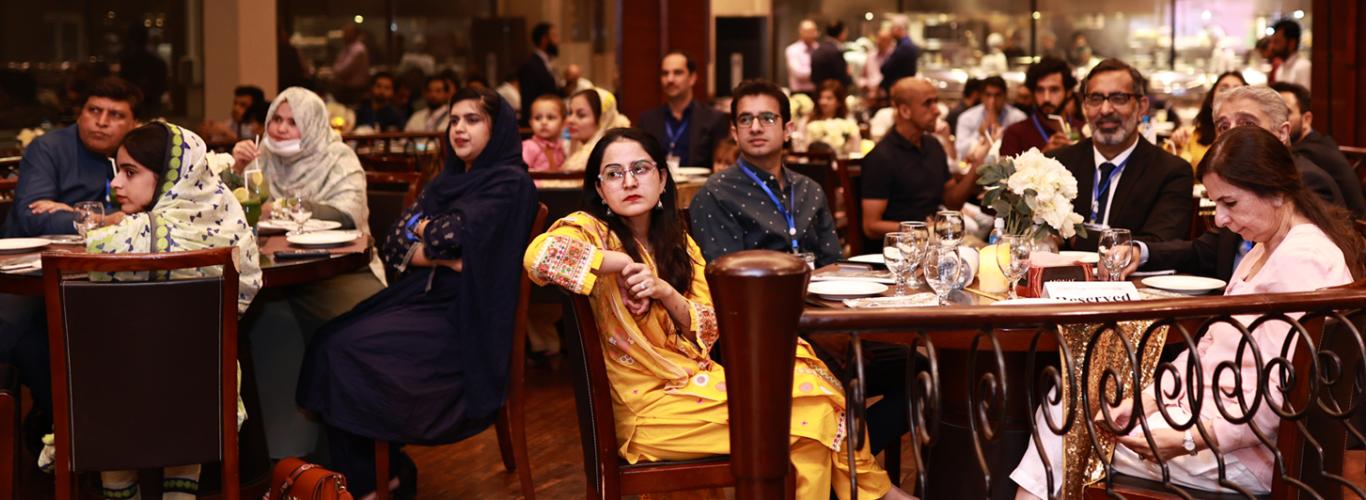 The Vice Chancellor sitting with alumni at the reunion 