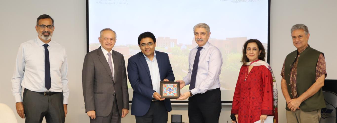 LUMS leadership giving Anwar Kabir a LUMS souvenir