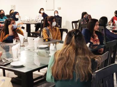 Participants sitting in the executive dining hall 