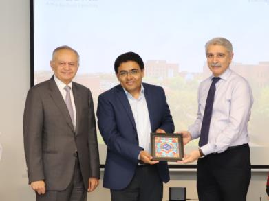 LUMS leadership giving Anwar Kabir a LUMS souvenir